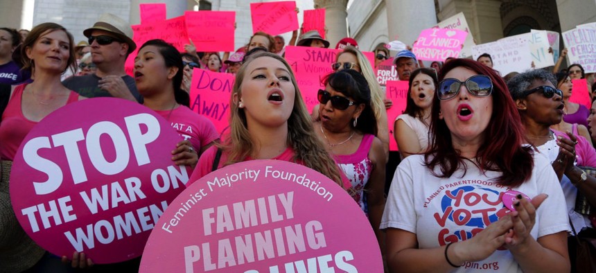 Planned Parenthood supporters rally for women's access to reproductive health care on "National Pink Out Day'' at Los Angeles City Hall in Sept. 2015.
