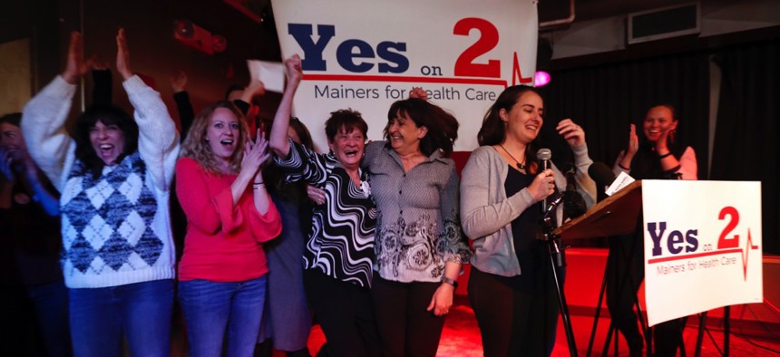 Supporters of Medicaid expansion celebrate their victory, Tuesday, Nov. 7, 2017, in Portland, Maine.