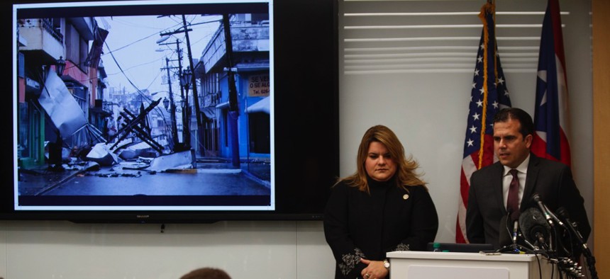 Puerto Rico Resident Commissioner Jenniffer González-Colón listens as Gov. Ricardo Rosselló speaks Monday during a Washington, D.C. news conference urging Congress to include the territory in the Supplemental Disaster Relief Package.