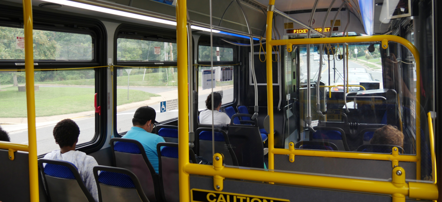 Commuters ride a bus in Falls Church, Virginia