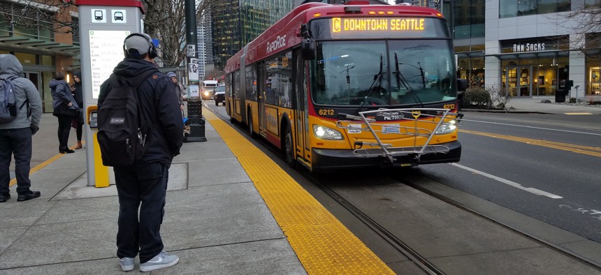 A Rapid Ride bus in Seattle uses a lane reserved for transit along Westlake Avenue.