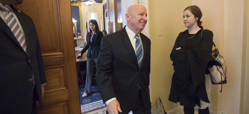 House Ways and Means Committee Chairman Kevin Brady, R-Texas, leaves his office in the Capitol as House Republicans prepare to advance the GOP tax bill, in Washington, Friday, Dec. 15, 2017.