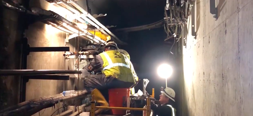Repair crews work in a tunnel to restore power to Hartsfield-Jackson International Airport in Atlanta. 