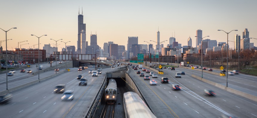 The Chicago Transit Authority's Red Line emerges into the center of the Dan Ryan Expressway south of the Chicago Loop.