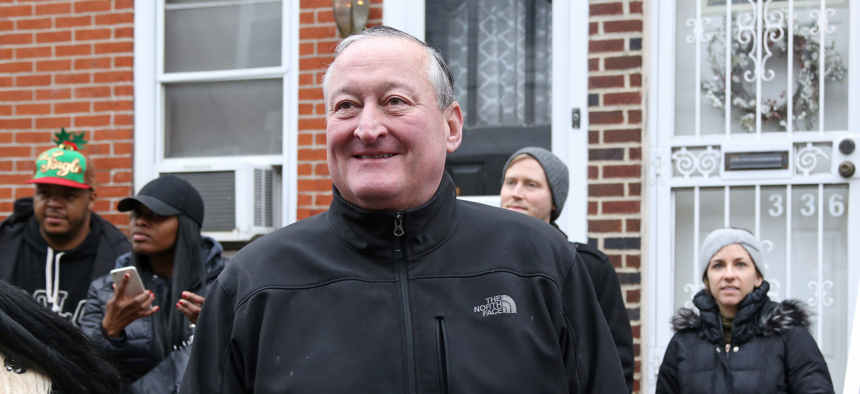 Philadelphia Mayor Jim Kenney assists with Operation Holiday Help in December.