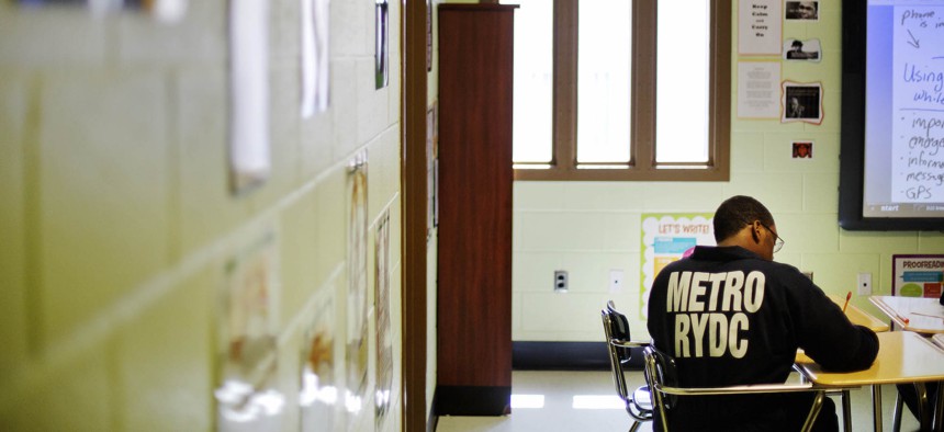 A juvenile resident sits in a classroom at the Department of Juvenile Justice's Metro Regional Youth Detention Center, Wednesday, Aug. 20, 2014, in Atlanta. 
