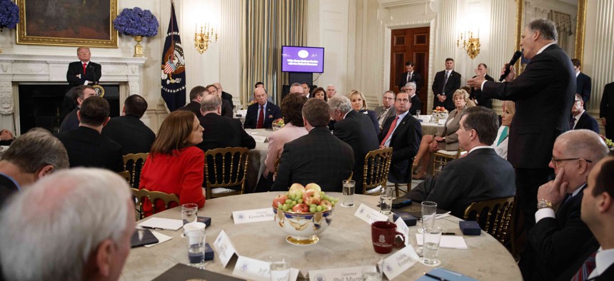 Gov. Jay Inslee, D-Wash., right, speaks about school safety during an event with President Donald Trump and members of the National Governors Association in the State Dining Room of the White House, Monday, Feb. 26, 2018, in Washington.