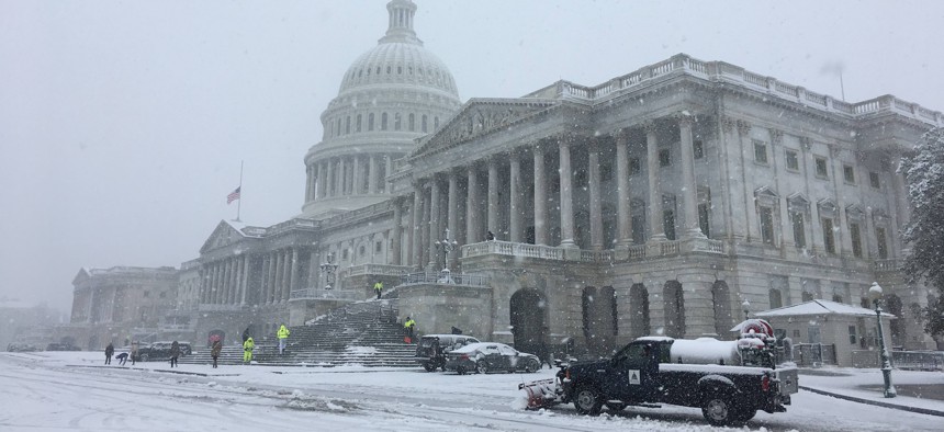 The U.S. Capitol during a snow storm on Wednesday, March 21, 2018.