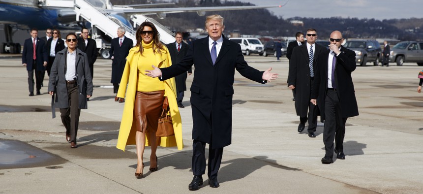 President Trump and first lady Melania Trump walk to greet supporters after arriving at Cincinnati Municipal Lunken Airport, Monday, Feb. 5, 2018, in Cincinnati.