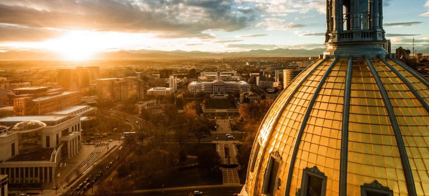 A sunset over the Colorado state capital building.