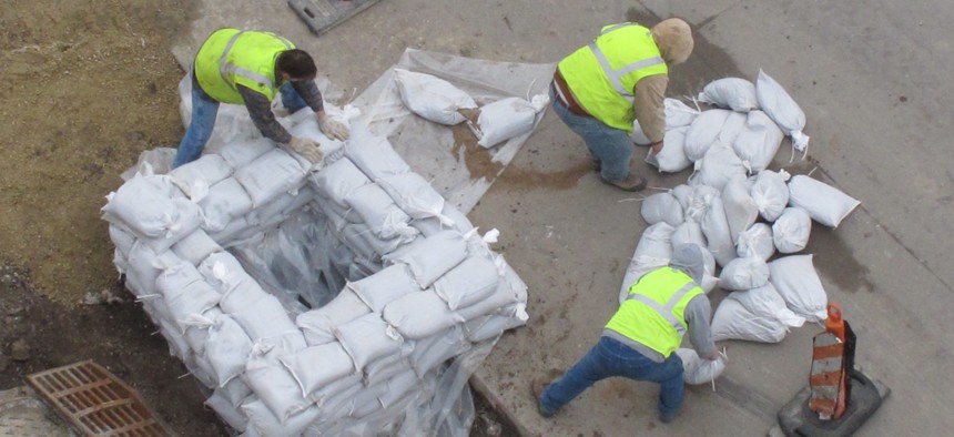 Workers fill up a pallet of sandbags outside of Modern Woodmen Park in Davenport, Iowa on Tuesday, March 22, 2011. 