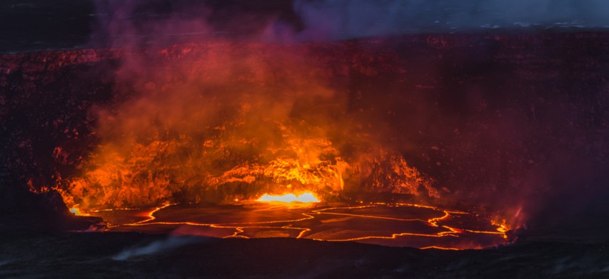 April 22, 2018: Kilauea Volcano's summit lava lake overflows onto Halemaumau Crater in Hawaii Volcanoes National Park on Hawaii's Big Island.