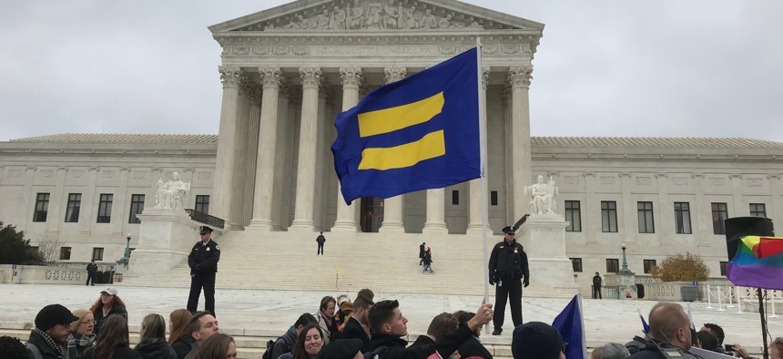 Human Rights Campaign Flag being waved at the Supreme Court of the United States on December 5, 2017 in support of gay rights during the Cake Shop Religious Liberties/Gay Rights case.