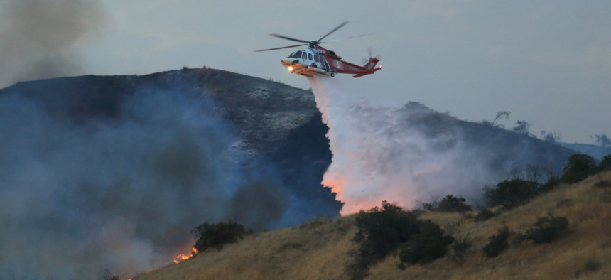 Sept. 2, 2017: A Los Angeles Fire Department helicopter drops flame retardant on the La Tuna Fire that's burned over 8,000 acres (one of the largest fires in L.A. history.)