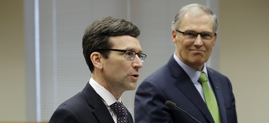 Washington State Attorney General Bob Ferguson, left, and Gov. Jay Inslee.