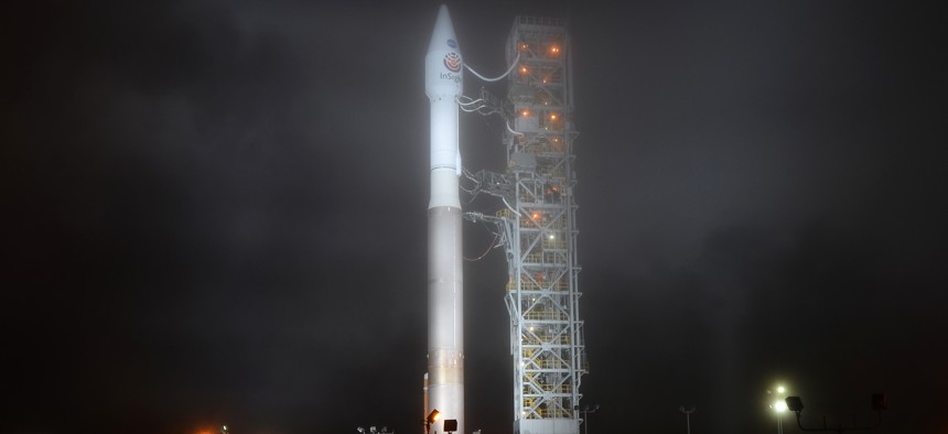 Vandenberg Air Force Base, CA-May 4, 2018: An Atlas V rocket stands ready as fog begins to roll in several hours before the launch of the InSight Mars lander into space at 4:05 a.m. 