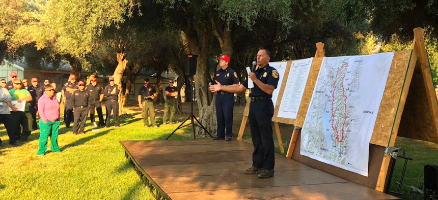 Chief Ken Pimlott, who directs the Cal Fire, addresses fire crews at a County Fire briefing on Monday morning.