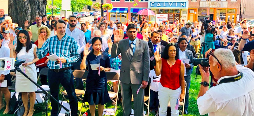New U.S. citizens are sworn in at a naturalization ceremony on July 4 in Northampton, Massachusetts.