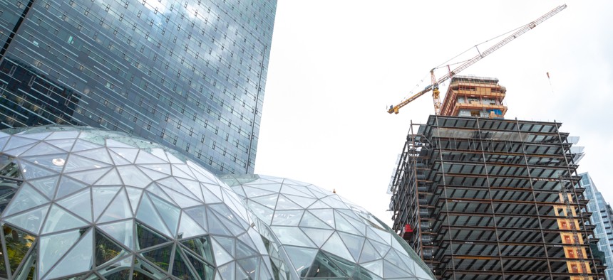 SEATTLE, WASHINGTON/USA - May 29, 2018: Wide angle view on the glass Spheres at the Seattle Amazon headquarters, with Day One office tower and new building under construction in the background.