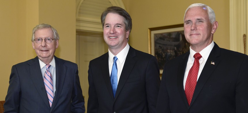 Senate Majority Leader Mitch McConnell of Ky., left, poses for a photo with Supreme Court nominee Brett Kavanaugh, center, and Vice President Mike Pence, right, as they visit Capitol Hill in Washington, Tuesday, July 10, 2018. 