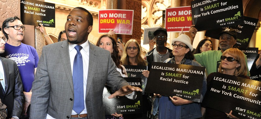Chris Alexander, policy coordinator for Drug Policy Alliance, speaks as advocates urge New York state legislators to support the Marijuana Regulation and Taxation Act at the state Capitol, Tuesday, May 8, 2018, in Albany, New York.