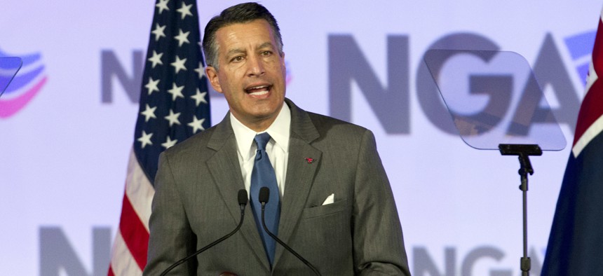 In this file photo, National Governors Association (NGA) Chair, Gov. Brian Sandoval of Nevada speaks during the National Governor Association 2018 winter meeting, on Feb. 24, 2018, in Washington, D.C.