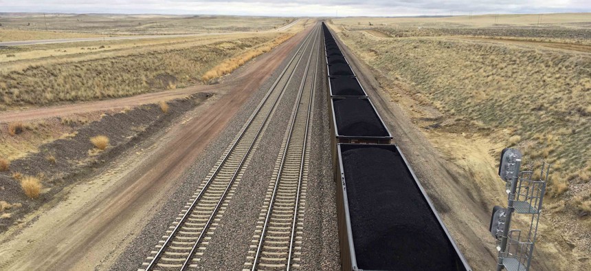In this March 28, 2017, file photo, a train near hauls coal mined from Wyoming's Powder River Basin near Bill, Wyo.