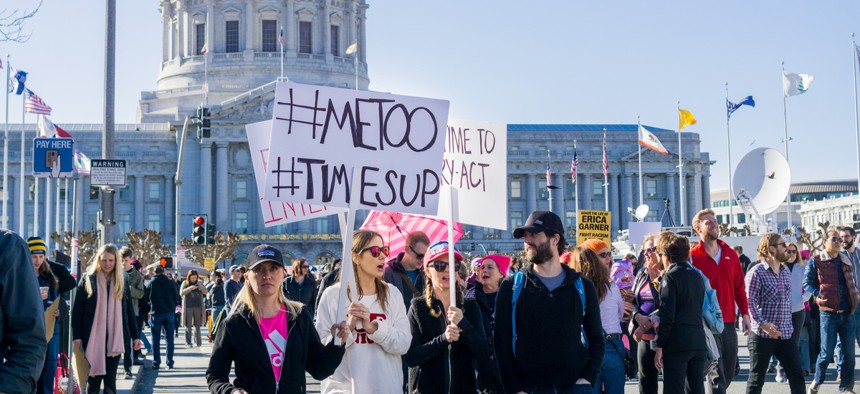 January 20, 2018 San Francisco / CA / USA - Women's March protesters begin to walk; #metoo and #timesup slogans written on a sign at the rally held in front of the City Hall.