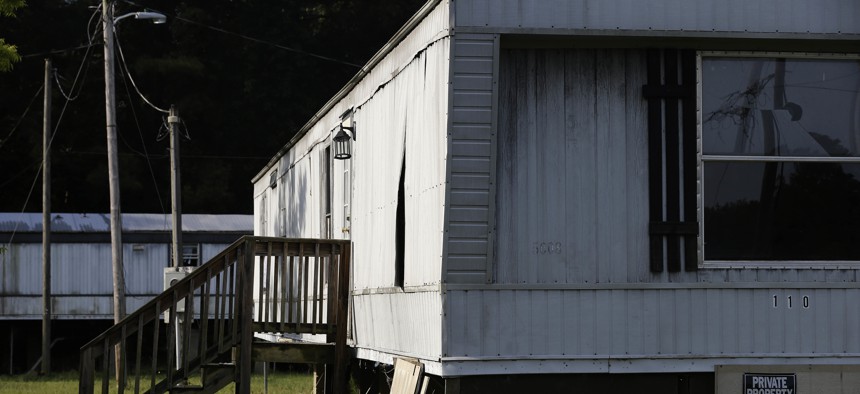 In this photo taken July 14, 2017, abandoned mobile homes are seen near Windsor, N.C., located in Bertie County.