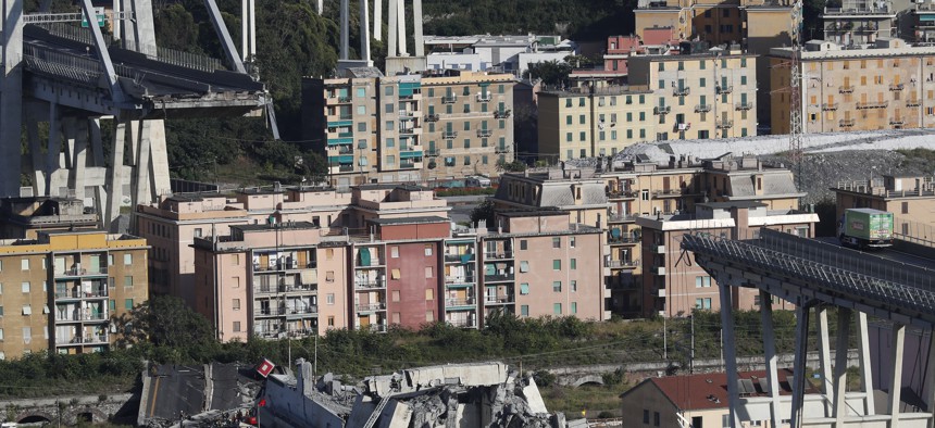 A view of the Morandi highway bridge after a section of it collapsed, in Genoa, northern Italy, Tuesday, Aug. 14, 2018.