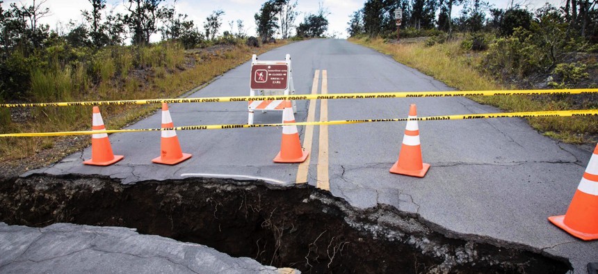 A large sinkhole at the Kilauea Overlook intersection inside Hawaii Volcanoes National Park on Hawaii.