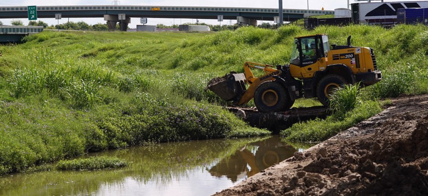 Work continues along Hunting Bayou in Houston. The bayou was one of many that overflowed during Hurricane Harvey.