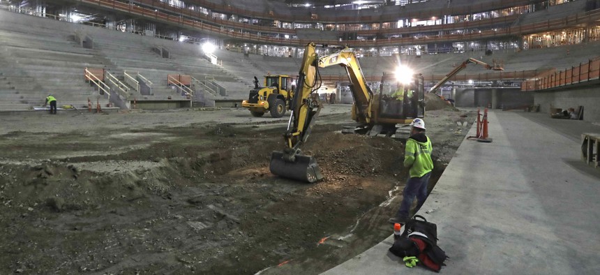 In this Jan. 3, 2017, file photo, workers begin excavation for an arena in Detroit that tax increment financing was used to help develop.