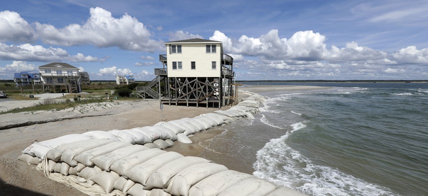Sand bags surround homes on North Topsail Beach, N.C., Wednesday, Sept. 12, 2018, as Hurricane Florence threatens the coast.