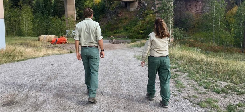 Michael Beach, wilderness and trails manager for the U.S. Forest Service Eagle-Holy Cross Ranger District, and Marcia Gilles, deputy district ranger, walk toward a meadow on the outskirts of Vail that’s been a hotspot for illegal camping in the past. 