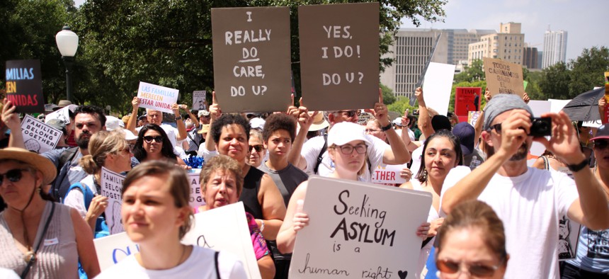 Demonstrators protest on June 30, 2018 at an anti-family separation immigration rally at the state capitol in Austin, Texas.