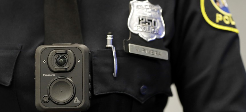 In this April 26, 2017 file photograph, a Newark, N.J. police officer displays how a body cam is worn during a news conference in Newark. 