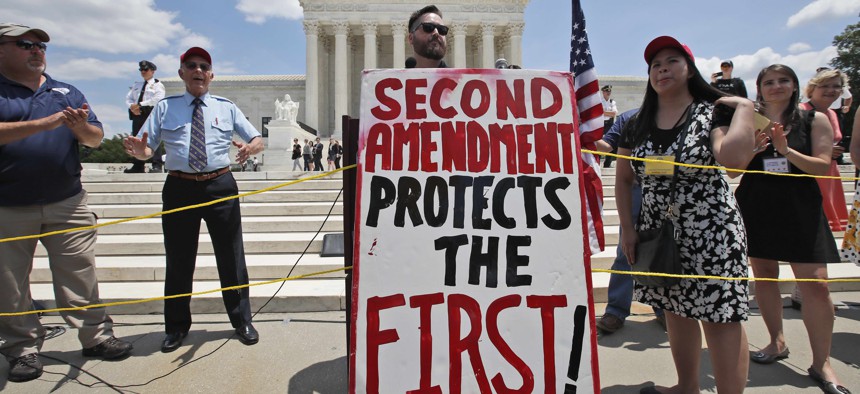Alexander DeGarmo from Greenwood, Neb., speaks about the second amendment in front of the Supreme Court, Tuesday, June 26, 2018 in Washington.