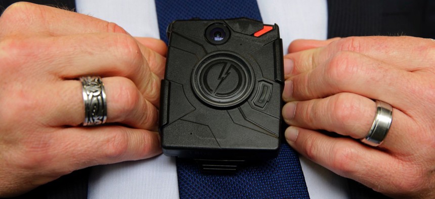Steve Tuttle, vice president of communications for Taser International, demonstrates one of the company's body cameras during a company-sponsored conference at the California Highway Patrol headquarters in Sacramento.