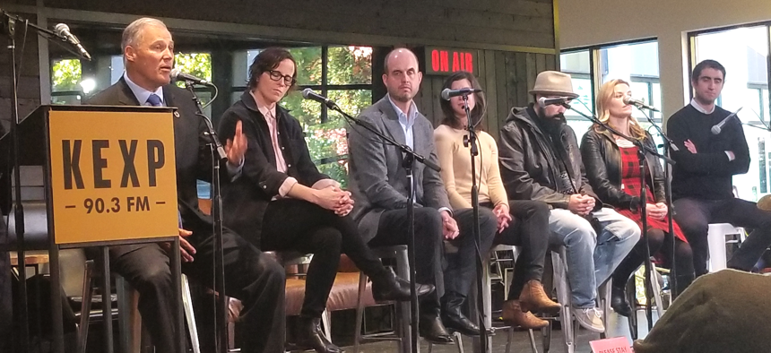 Washington Gov. Jay Inslee, far left, speaks at the KEXP Gathering Space on Tuesday in Seattle.