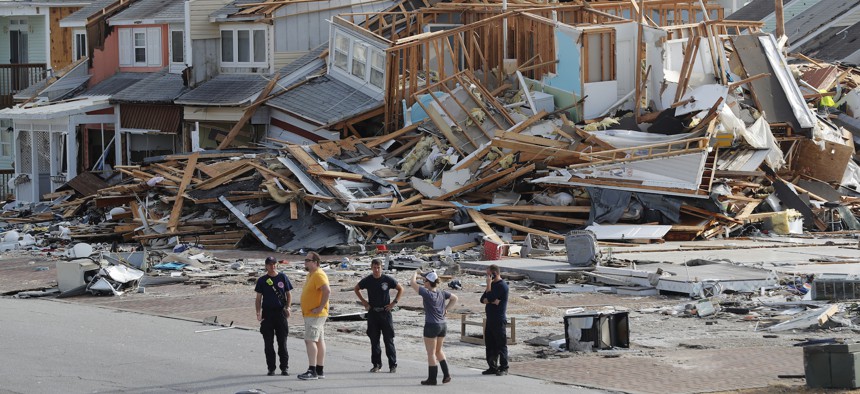 Search and rescue personnel on the ground in Mexico Beach, Florida following Hurricane Michael.