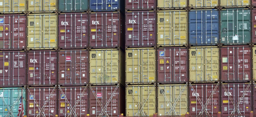 In this Thursday, July, 5, 2018 photo, a bay of 40-foot shipping container fill the stern of a container ship at the Port of Savannah in Savannah, Ga. 