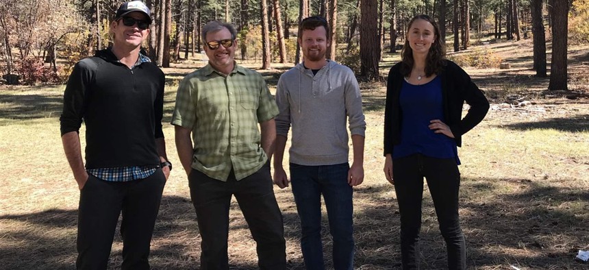 Anthony Culpepper, Aaron Kimple, Matt Cook and Laurel Sebastian—all of the Mountain Studies Institute—stand in a clearing atop Reservoir Hill in Pagosa Springs. The forest was thinned with the support of the local forest health collaborative.