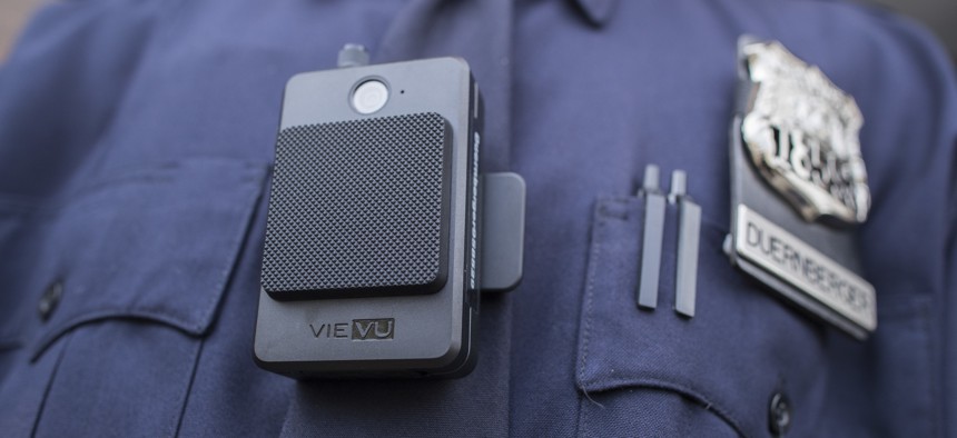 In this April 27, 2017, file photo, a police officer wears a newly issued body camera at the 34th precinct in New York. 
