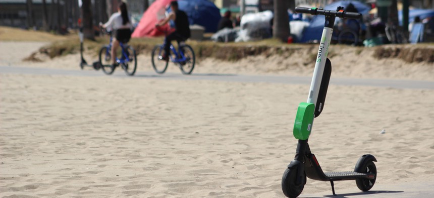 A Lime e-scooter along Venice Beach in Los Angeles.
