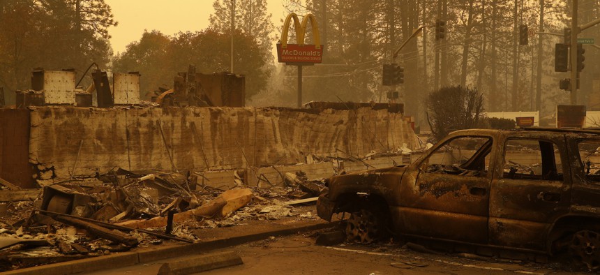 A sign still stands at a McDonald's restaurant burned in the Camp Fire, Monday, Nov. 12, 2018, in the northern California town of Paradise. 