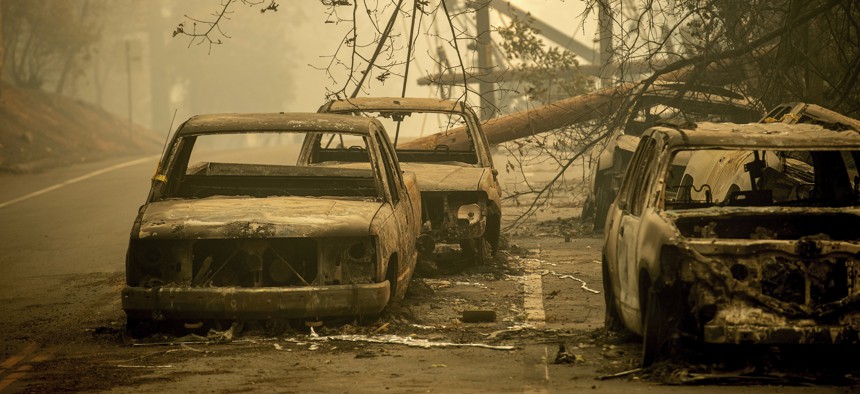 Abandoned cars, scorched by the wildfire, line Pearson Rd. in Paradise, Calif., on Saturday, Nov. 10, 2018.