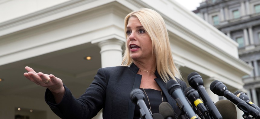 In this Thursday, Feb. 22, 2018 file photo, Florida Attorney General Pam Bondi speaks to reporters outside the White House.