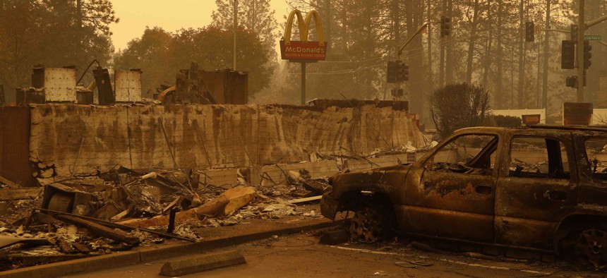 A sign still stands at a McDonald's restaurant burned in the Camp Fire, Monday, Nov. 12, 2018, in the northern California town of Paradise.