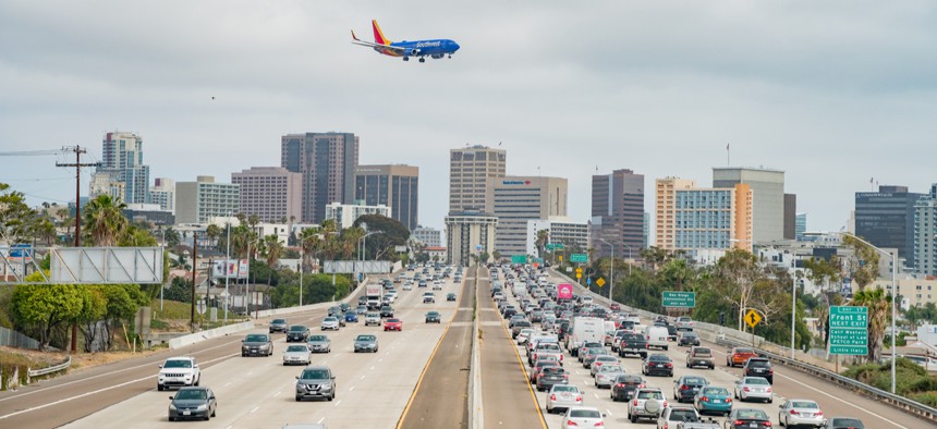 A plane prepares to land at San Diego International Airport near downtown San Diego.